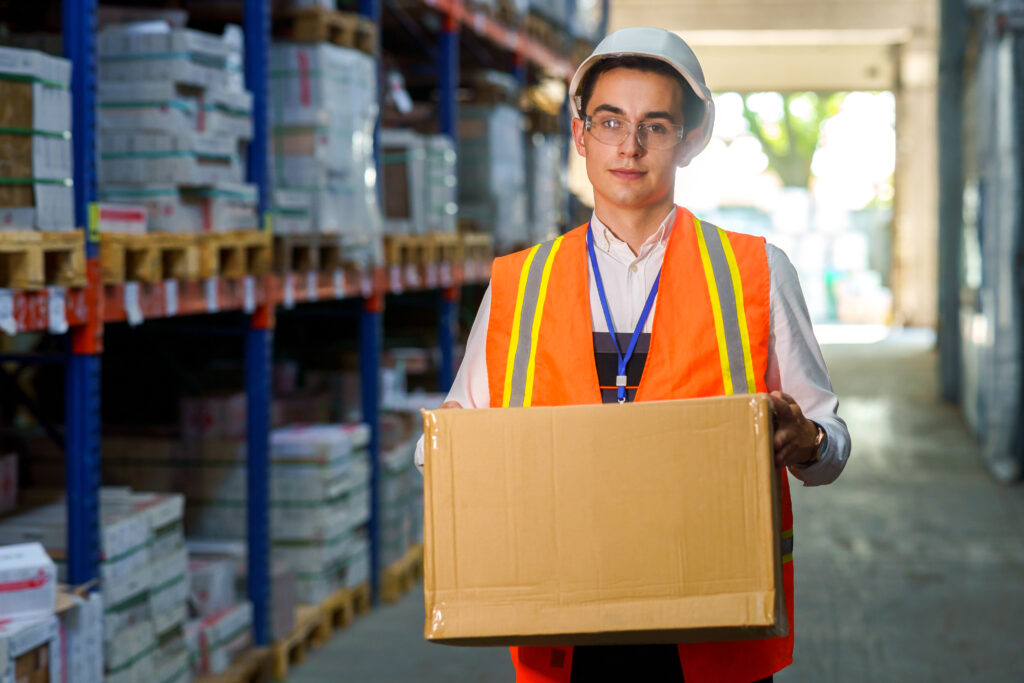 Warehouse worker with a box in his hands